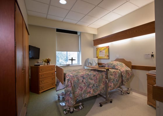 Clean and cozy resident room with floral bedding