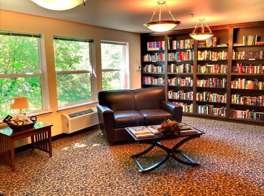 Cozy reading area with bookshelves and comfortable seating