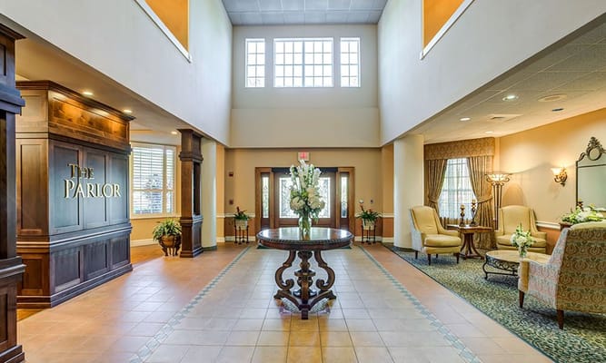 Welcoming lobby area with seating and floral arrangements