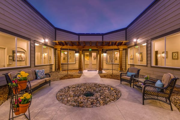 Outdoor courtyard area with seating and landscaping