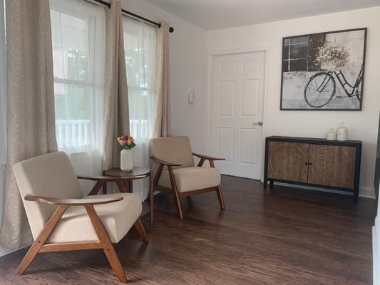 Comfortable seating arrangement in a living room with large windows