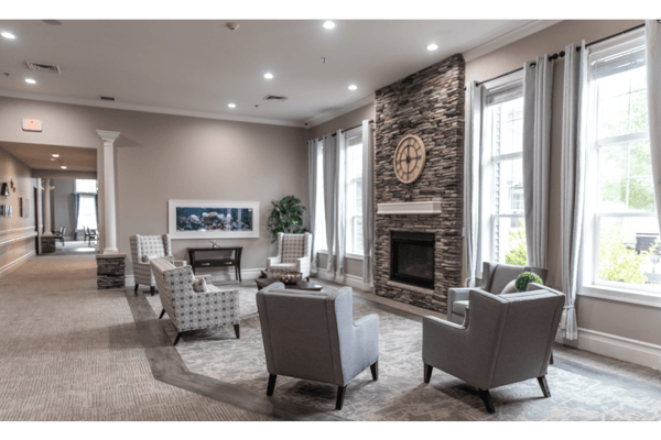 Common area with seating and stone fireplace