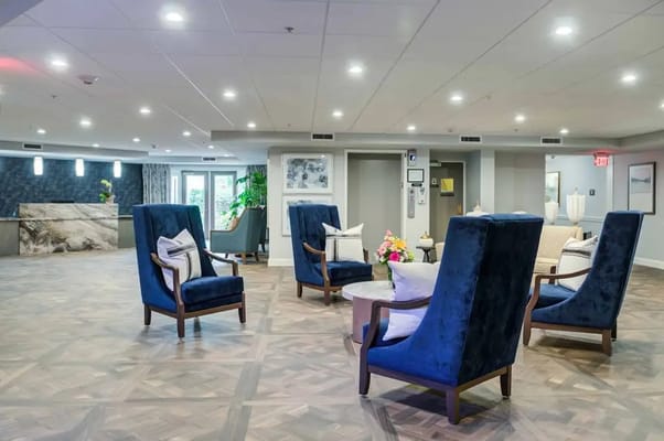 Lounge area featuring blue chairs and a coffee table in Silver Springs at East Norriton