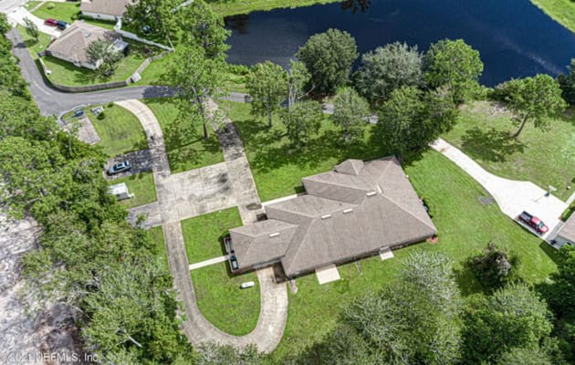 Aerial view of a senior living facility surrounded by greenery