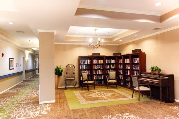 Library area with bookshelves and seating in Spring Hills Morristown
