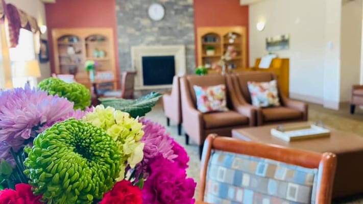 Interior living area with colorful flowers and seating