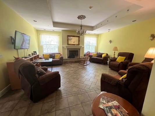 Cozy common area with comfortable seating and a fireplace