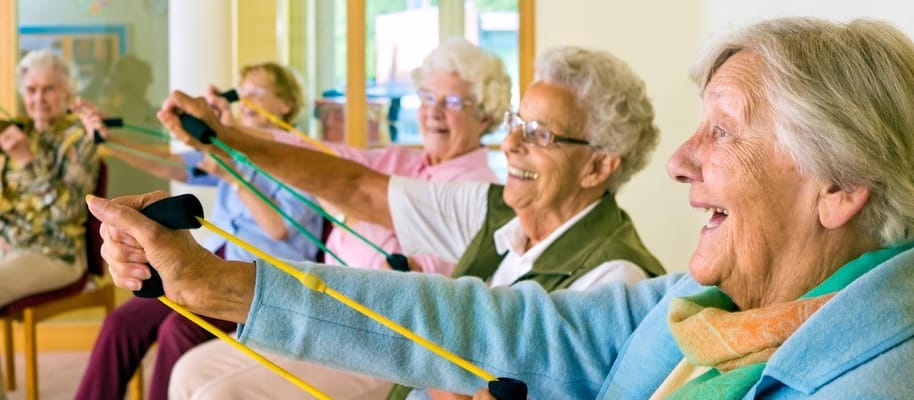 Seniors using resistance bands in an exercise class