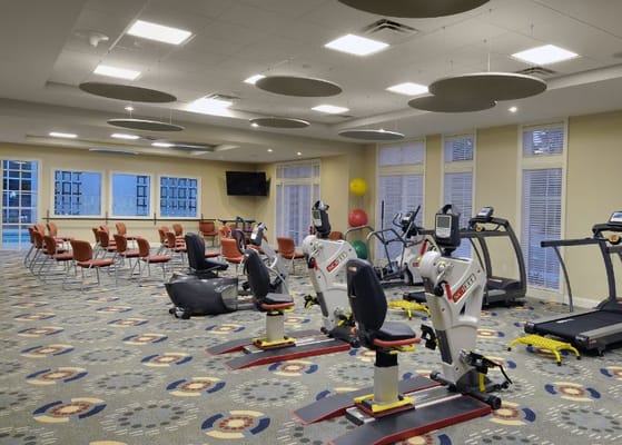 Well-equipped fitness room with exercise machines