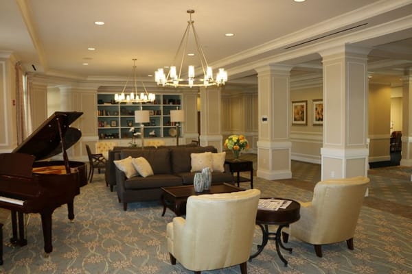 Interior common area with seating and piano