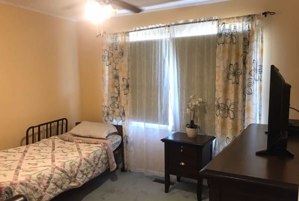 Cozy resident room with a bed and dresser