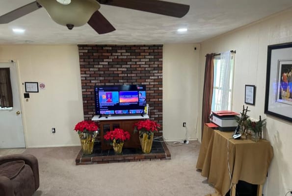 Cozy common area with seasonal decorations and a TV