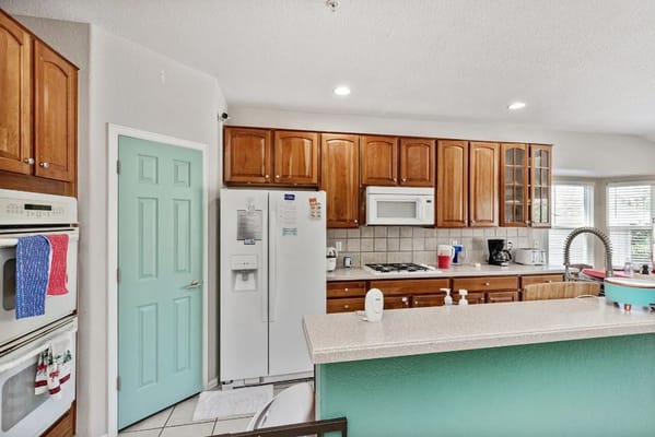 Modern kitchen with wooden cabinets and appliances