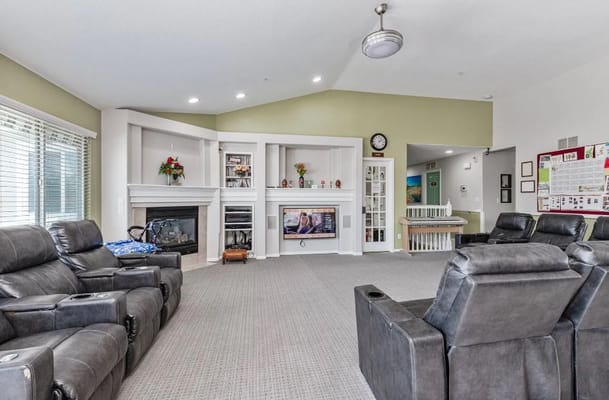 Living room with recliner chairs and fireplace