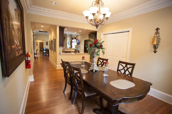 Dining table with chairs in a warmly lit room