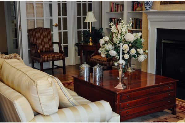 Cozy living room with floral arrangement and comfortable seating