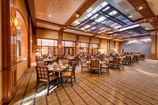 Well-appointed dining room with tables and chairs