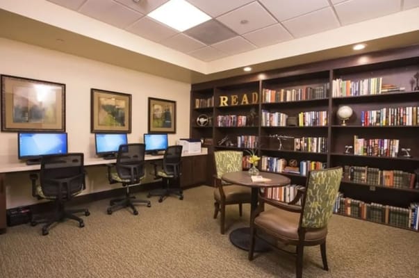 Cozy library area with computers and bookshelves
