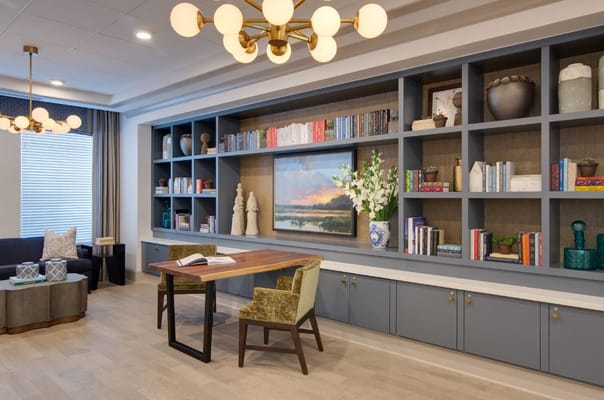 Inviting living room with a bookshelf, artwork, and stylish seating
