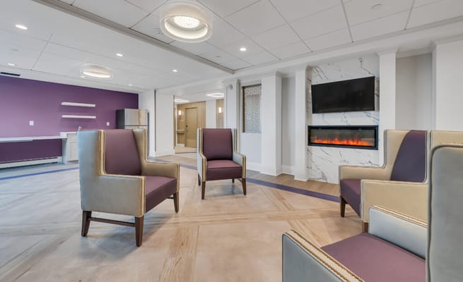 Comfortable lounge seating in a modern assisted living facility