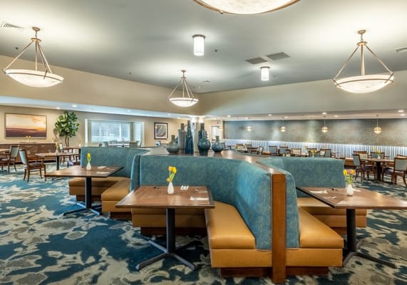 Spacious dining area with booth seating and decorative vases