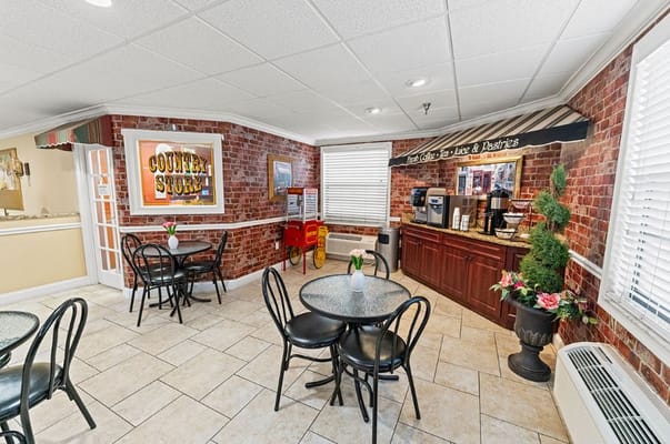 Cozy dining area with tables and a coffee station