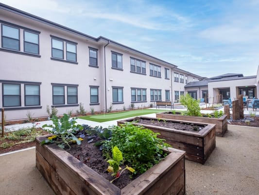Garden area with raised plant beds at the facility.