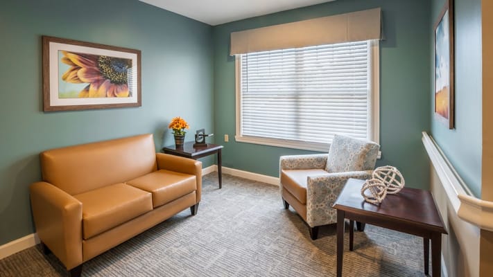 Cozy lounge area with furniture and artwork