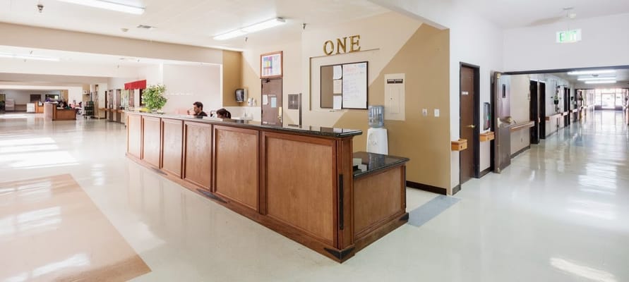 Reception area with staff at the front desk