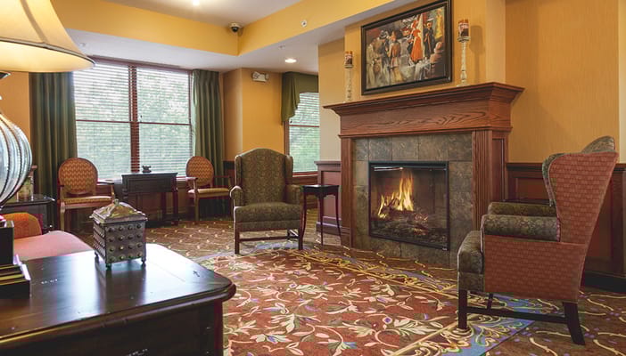 Cozy lounge area with seating and a fireplace