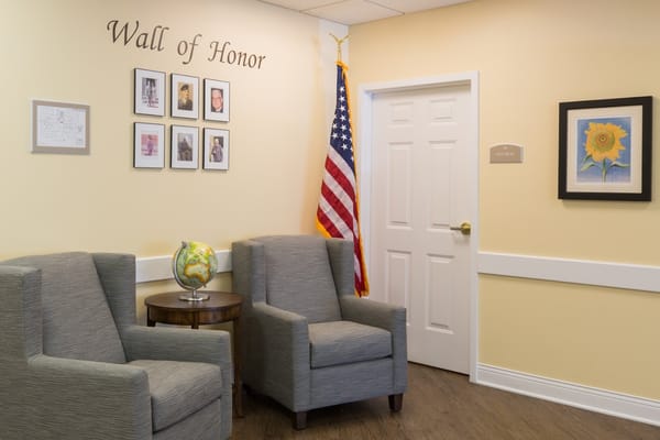 Common area with chairs and Wall of Honor