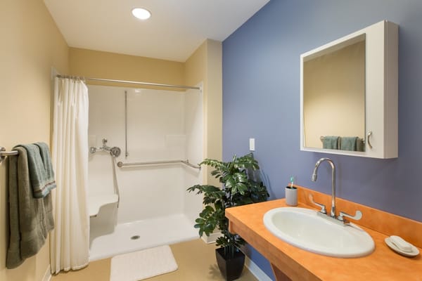 A well-lit, clean assisted living bathroom