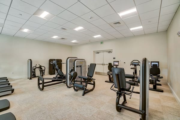 Well-equipped fitness room with exercise machines