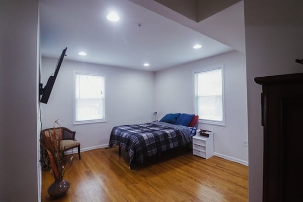 A well-furnished private resident room with natural light