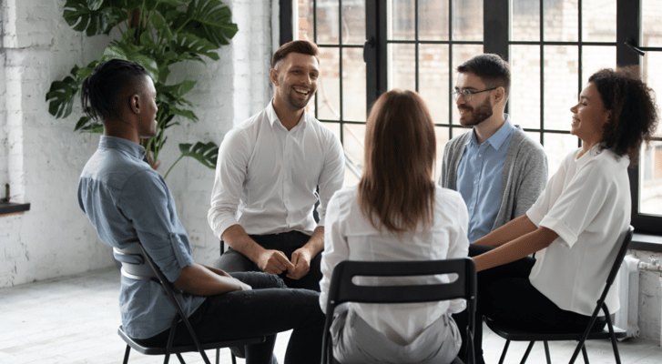 Residents engaging in a group activity in a bright room