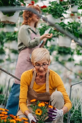 Residents gardening in a vibrant greenhouse