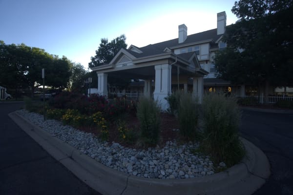 Exterior view of Woodland Estates with landscaping
