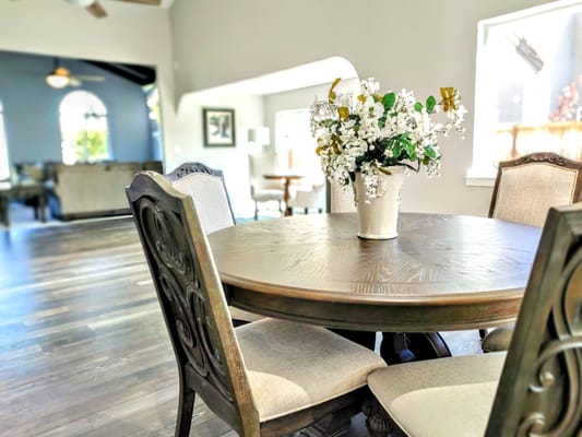 Bright interior dining space with a floral centerpiece