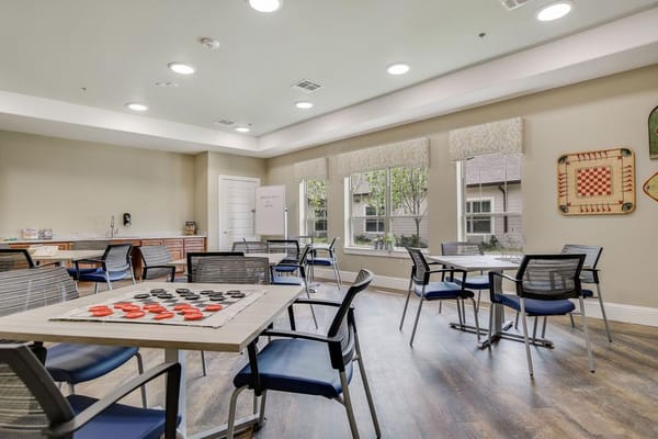 Interior common area with tables for activities