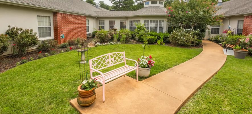 Garden area with a bench and flowers