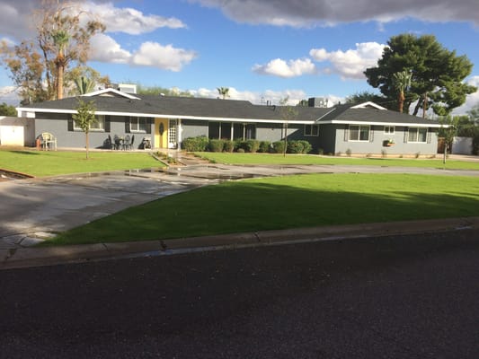 Exterior view of Well Heeled Homes facility on a sunny day