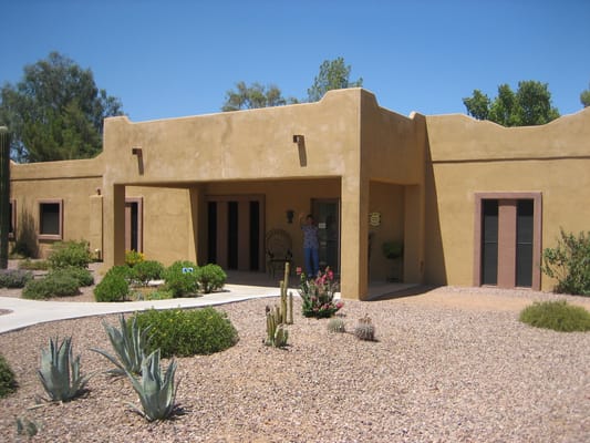 Outdoor view of a senior living facility with desert landscaping