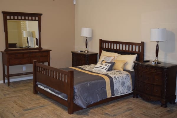 Well-furnished resident room with bed and mirror