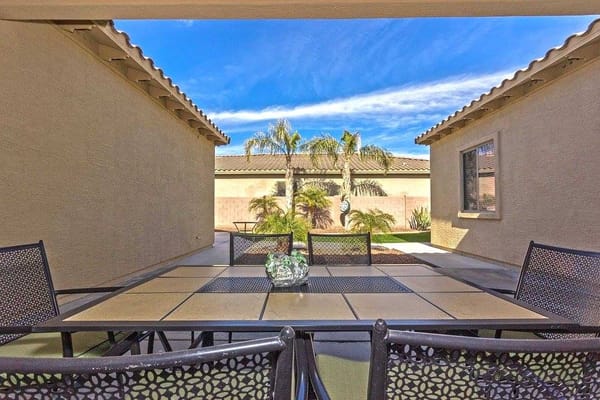 Outdoor patio area with a table and chairs
