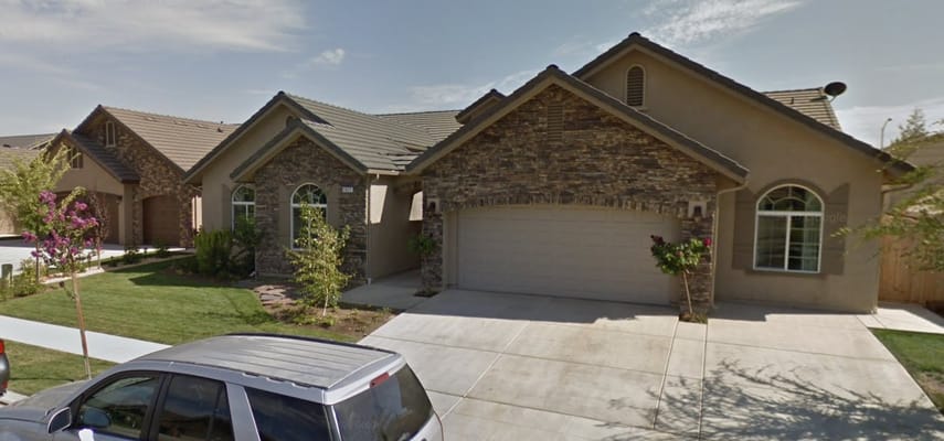 Exterior view of a residential building with landscaping