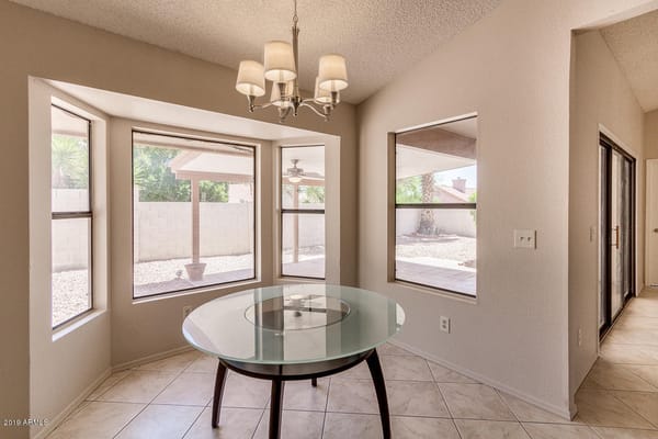 Bright dining area with a table and windows