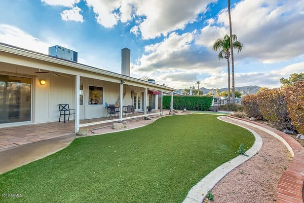 Lush green outdoor garden area at Aegis at Cassia Assisted Living.