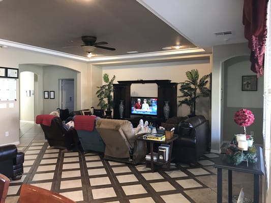 Common area with residents relaxing in a living room