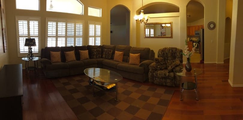 Comfortable living room with seating and a coffee table.