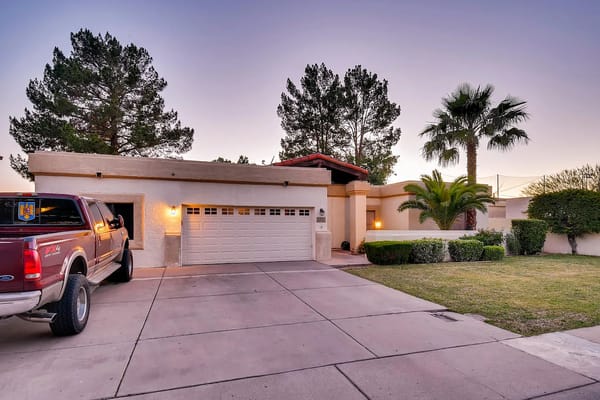 Front view of Amiga 2 Assisted Living Home with landscaped yard and driveway